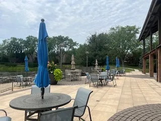 a view of a patio with a table chairs and a table