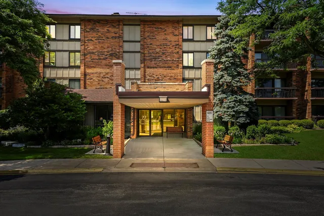 a front view of a building with garden