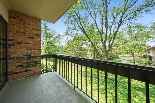 a view of a balcony with a trees