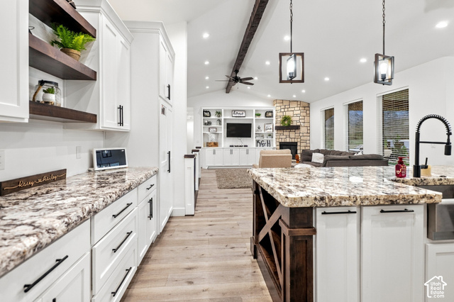 244 East Sevier River Road Central Valley, UT 84754 - Photo 30 of 66 Kitchen featuring white cabinetry, stone countertops, wood-finish flooring, and built-in shelving