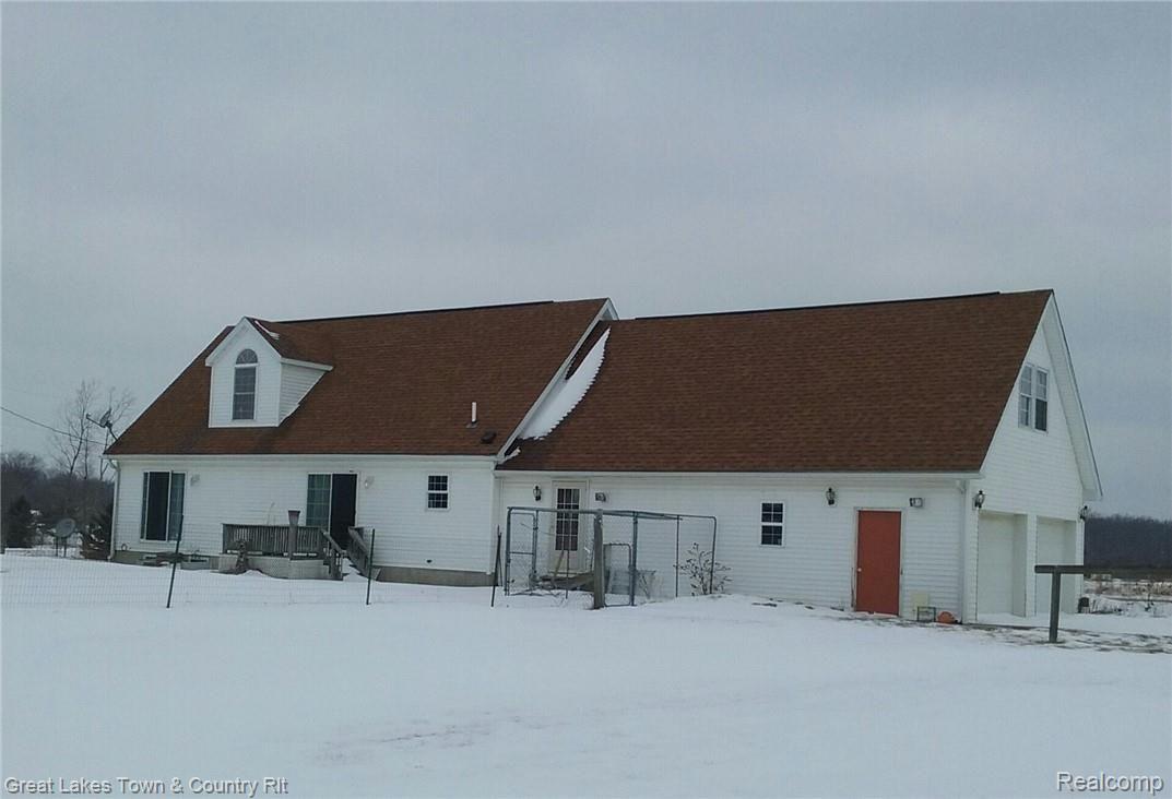3065 West Sutton Road Lapeer, MI 48446 - Photo 2 of 19 Back of house 2.jpg