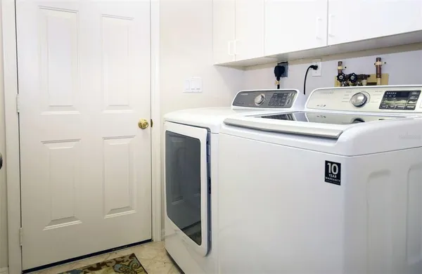 a utility room with dryer and washer