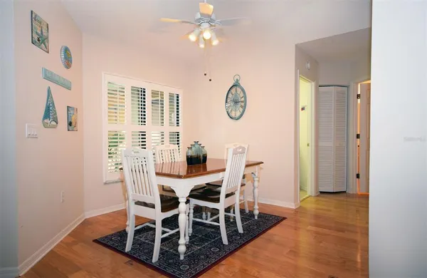 a view of a dining room with furniture and window