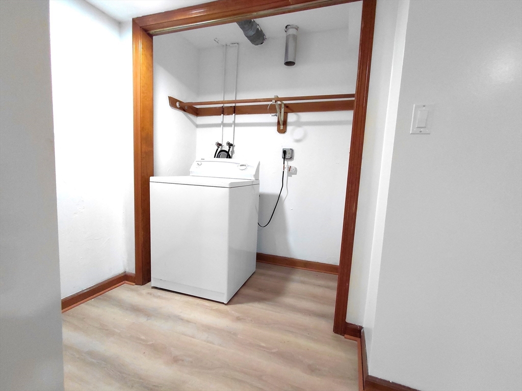 117 Metropolitan Avenue, Unit 117 Ashland, MA 01721 - Photo 12 of 15 a view of a storage & utility room with a washer dryer