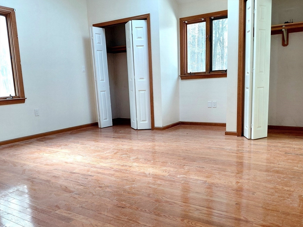 117 Metropolitan Avenue, Unit 117 Ashland, MA 01721 - Photo 4 of 15 an empty room with closet