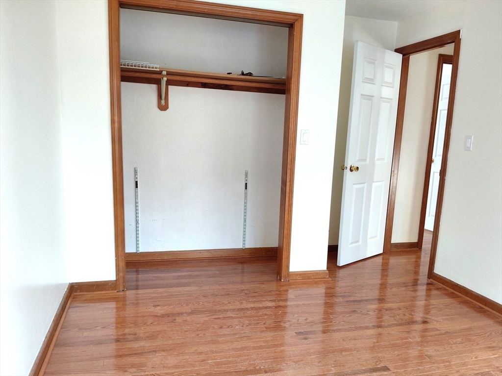 117 Metropolitan Avenue, Unit 117 Ashland, MA 01721 - Photo 7 of 15 a view of a room with wooden floor