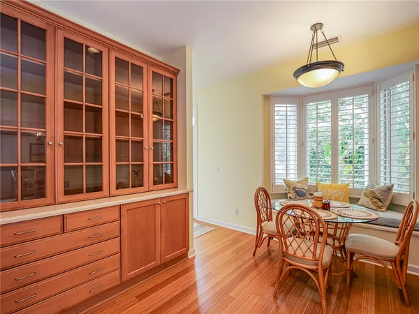 a view of a dining room with furniture window and outside view
