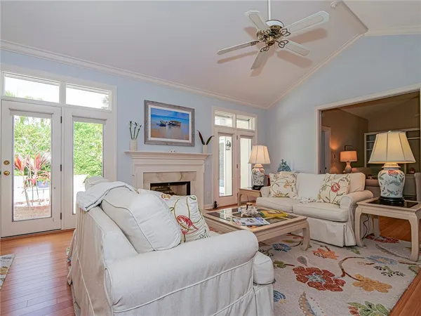 a living room with furniture fireplace and window