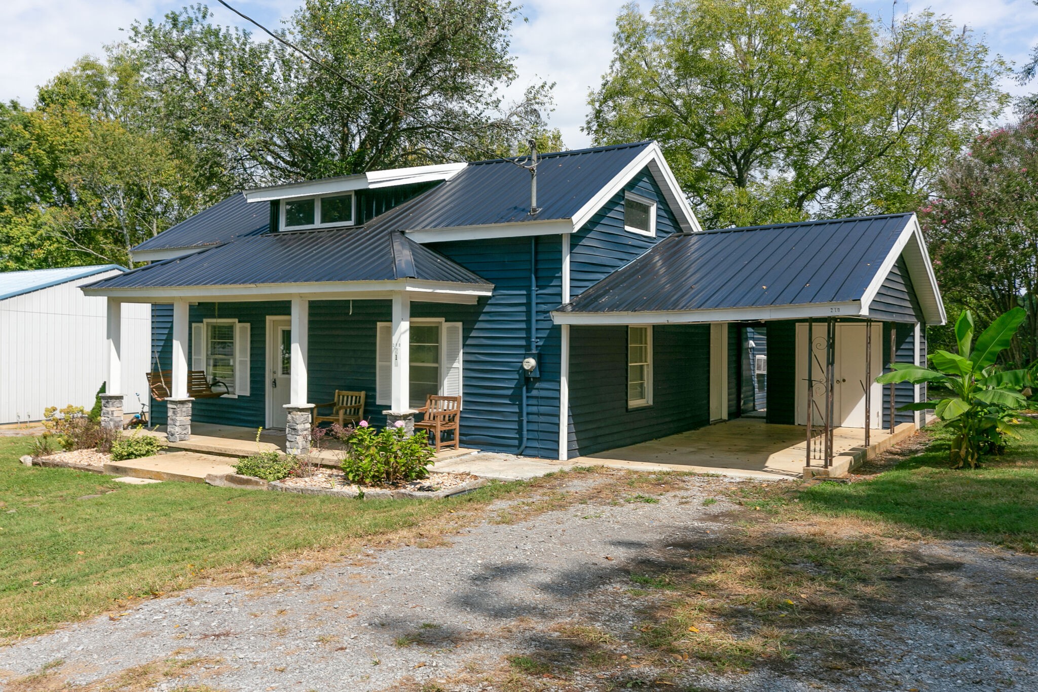 210 Old Rover Road Rockvale, TN 37153 - Photo 2 of 41 a front view of a house with sitting area and garden