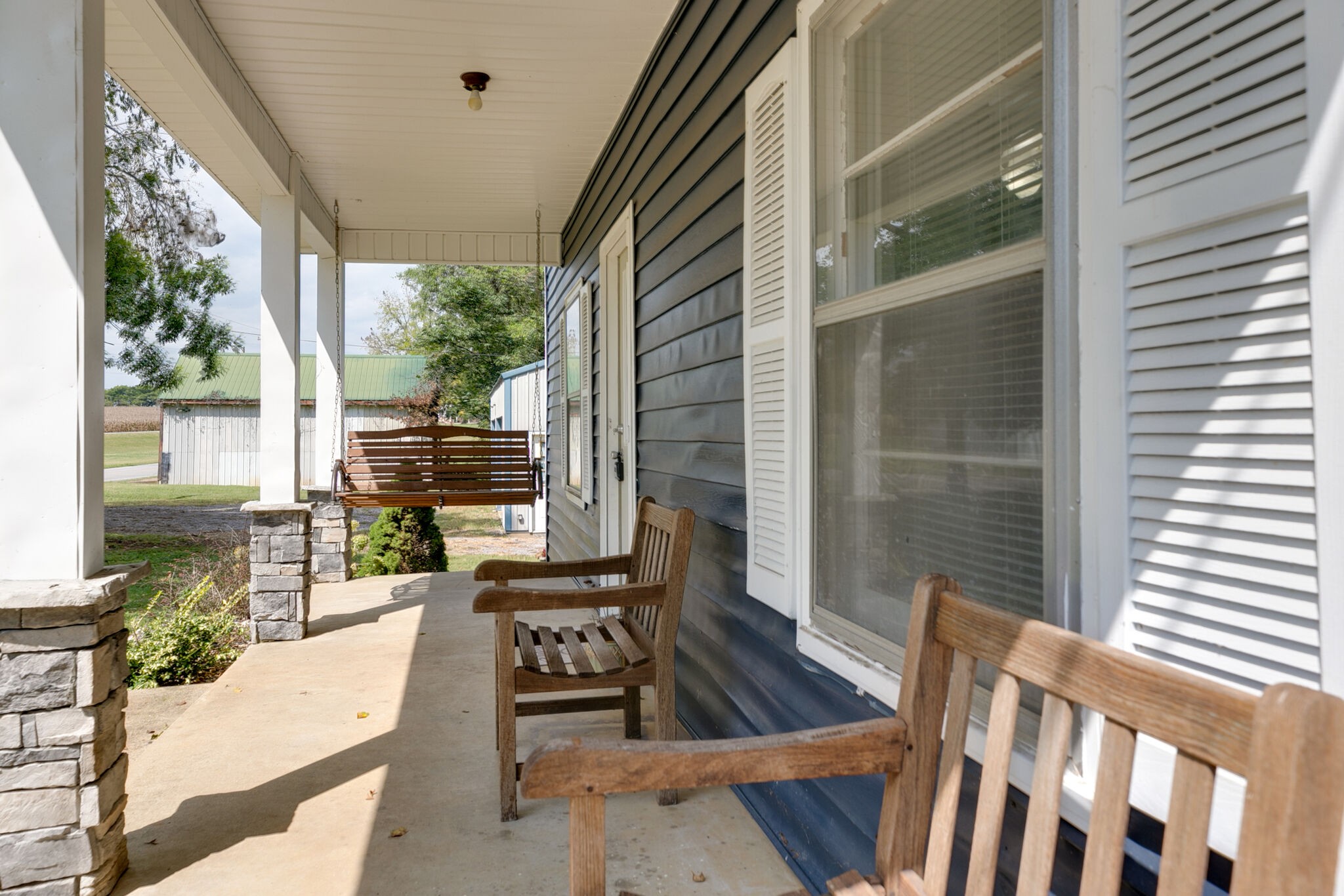 210 Old Rover Road Rockvale, TN 37153 - Photo 5 of 41 a view of a patio with a dining table and chairs with wooden floor