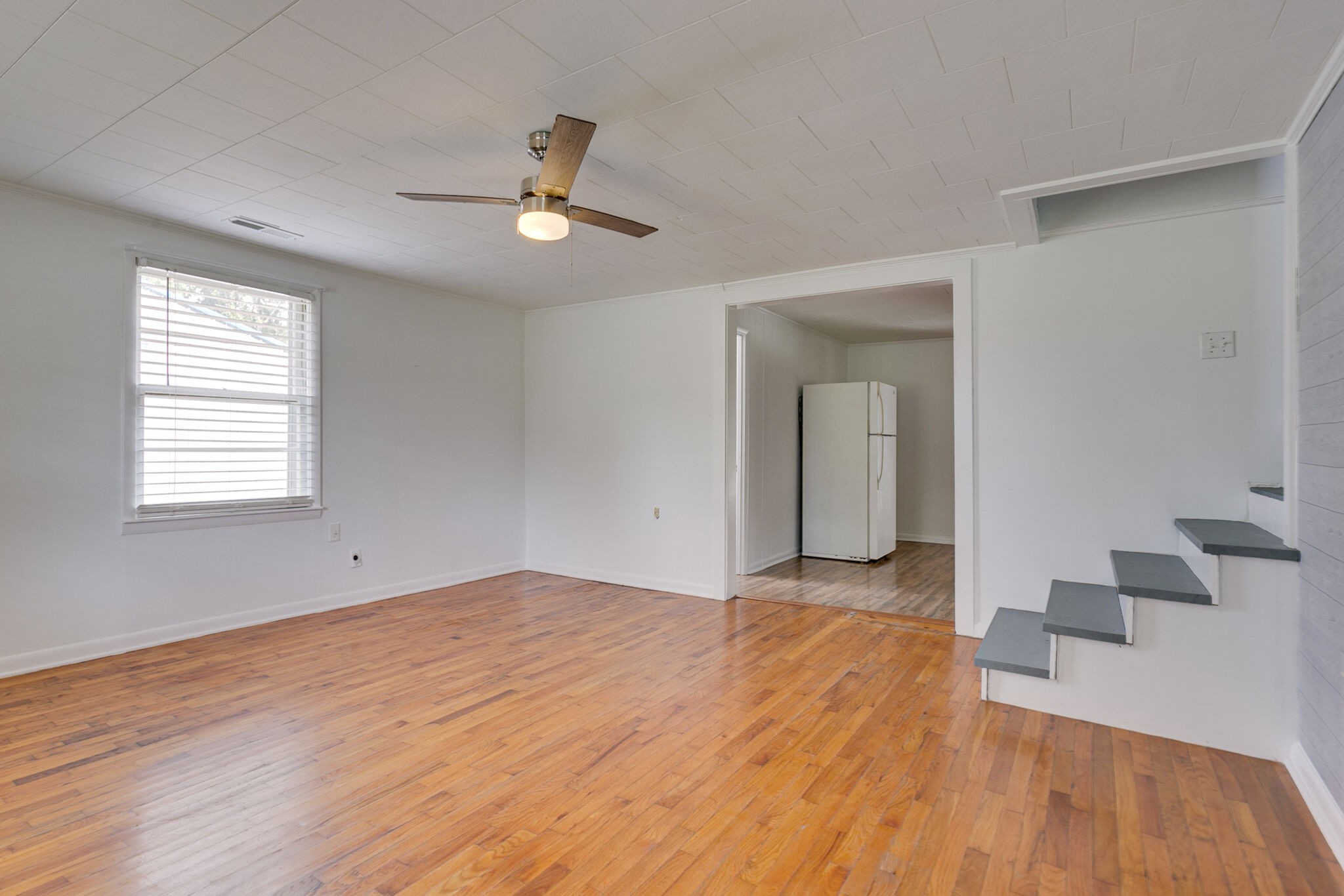 210 Old Rover Road Rockvale, TN 37153 - Photo 6 of 41 a view of an empty room with wooden floor and a window