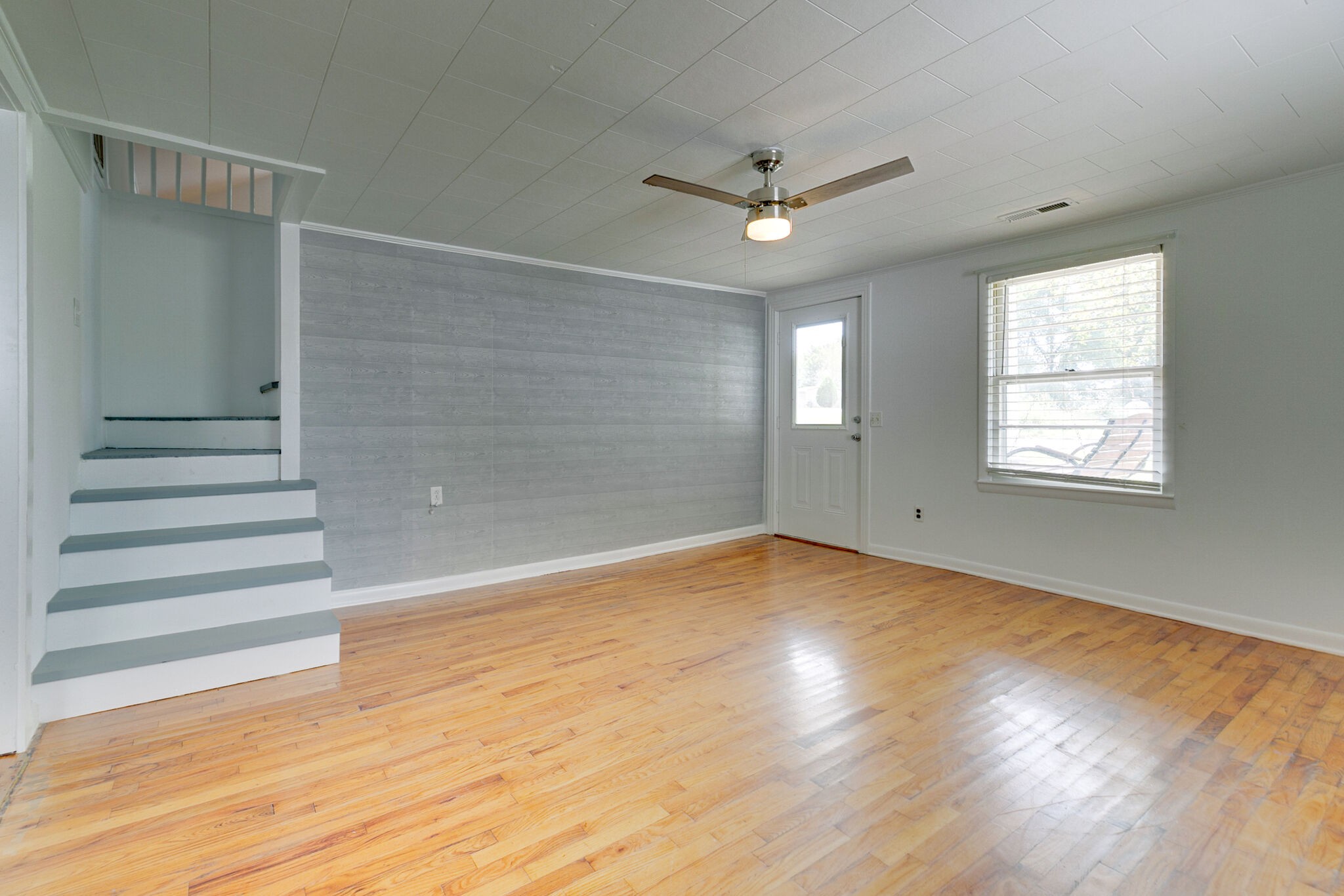 210 Old Rover Road Rockvale, TN 37153 - Photo 8 of 41 a view of empty room with wooden floor and fan