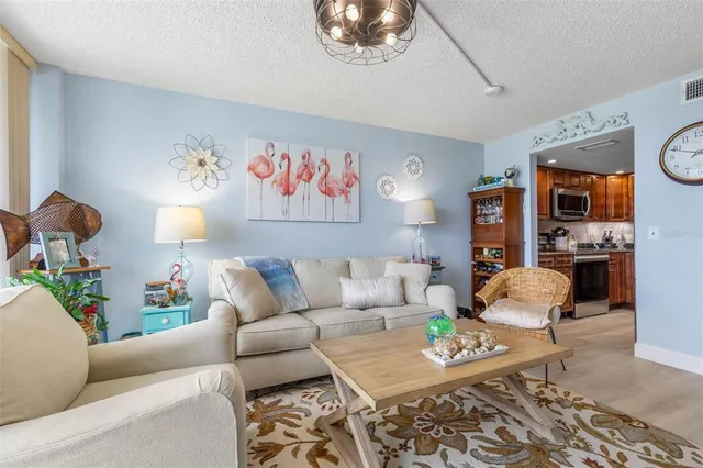 a kitchen with stainless steel appliances granite countertop a sink stove and microwave