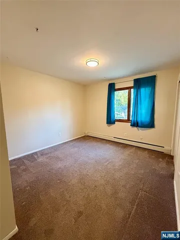 an empty room with a empty space and window