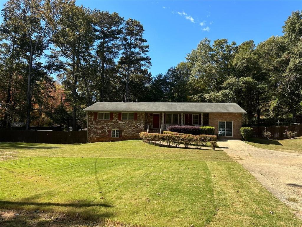 3560 New MacLand Road Powder Springs, GA 30127 - Photo 1 of 1 a view of a house with swimming pool and sitting area