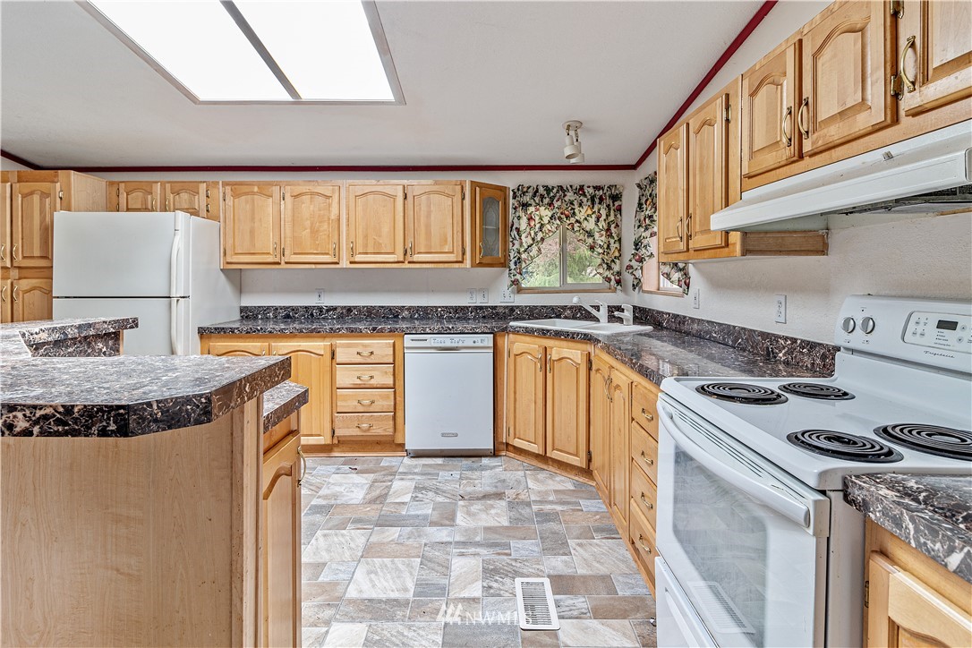 440 Kirkland Road Chehalis, WA 98532 - Photo 2 of 36 a kitchen with a stove top oven sink and cabinets