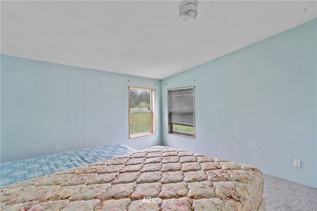 440 Kirkland Road Chehalis, WA 98532 - Photo 25 of 36 a bedroom with a bed and a window