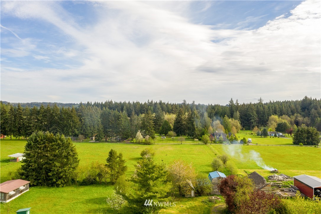 440 Kirkland Road Chehalis, WA 98532 - Photo 35 of 36 a view of a lake with houses in the back