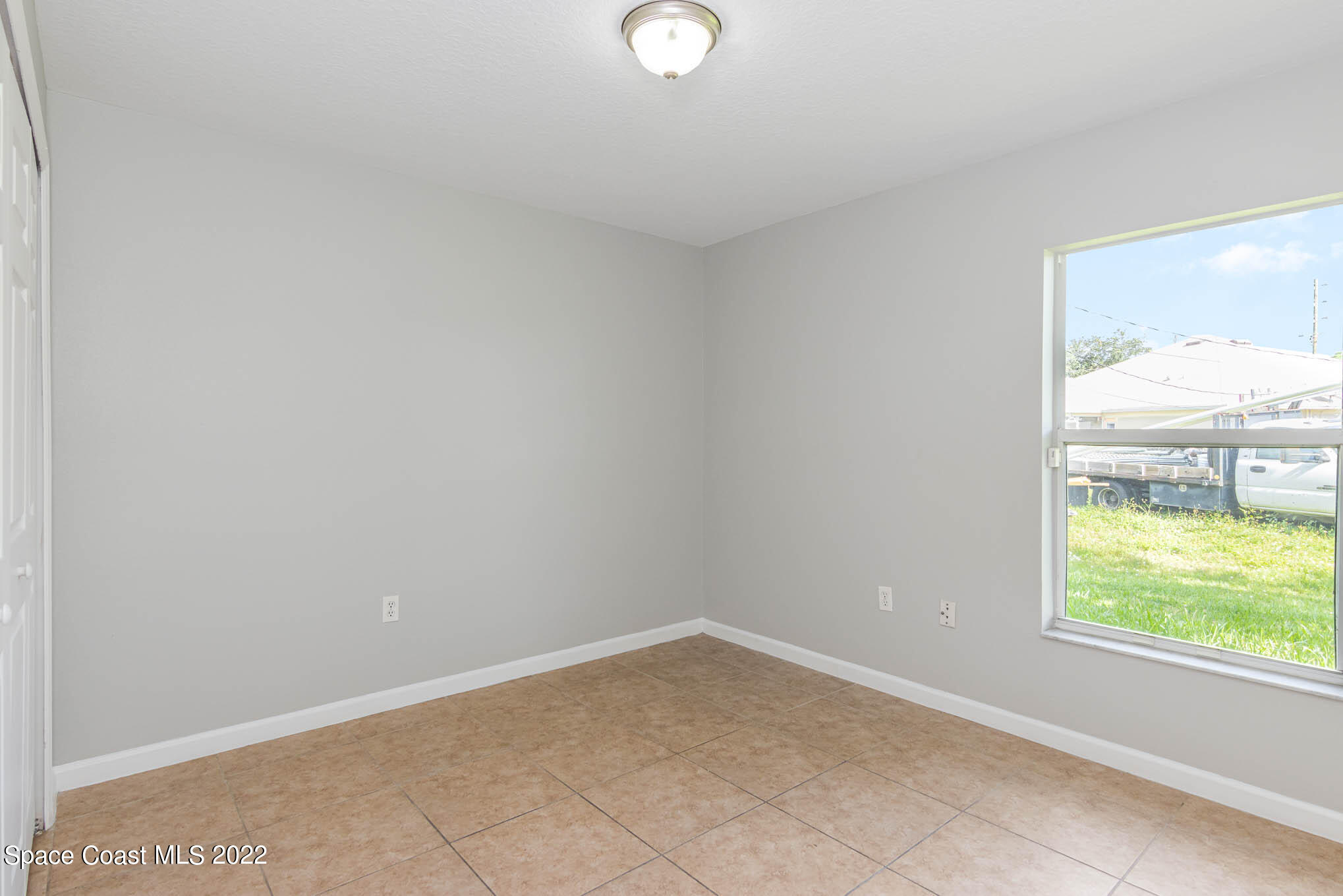 909 San Rafael Road Southwest Palm Bay, FL 32908 - Photo 17 of 24 a view of a small space with a window