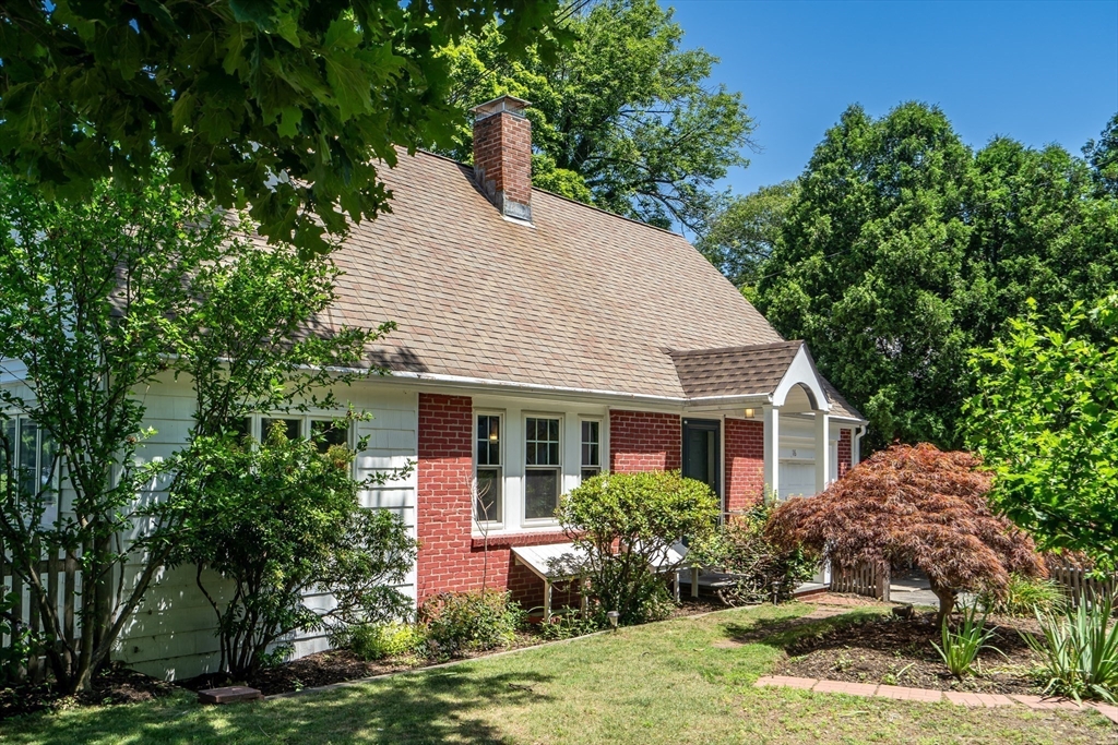16 Roundwood Road Newton, MA 02464 - Photo 38 of 41 a view of a house with yard and plants