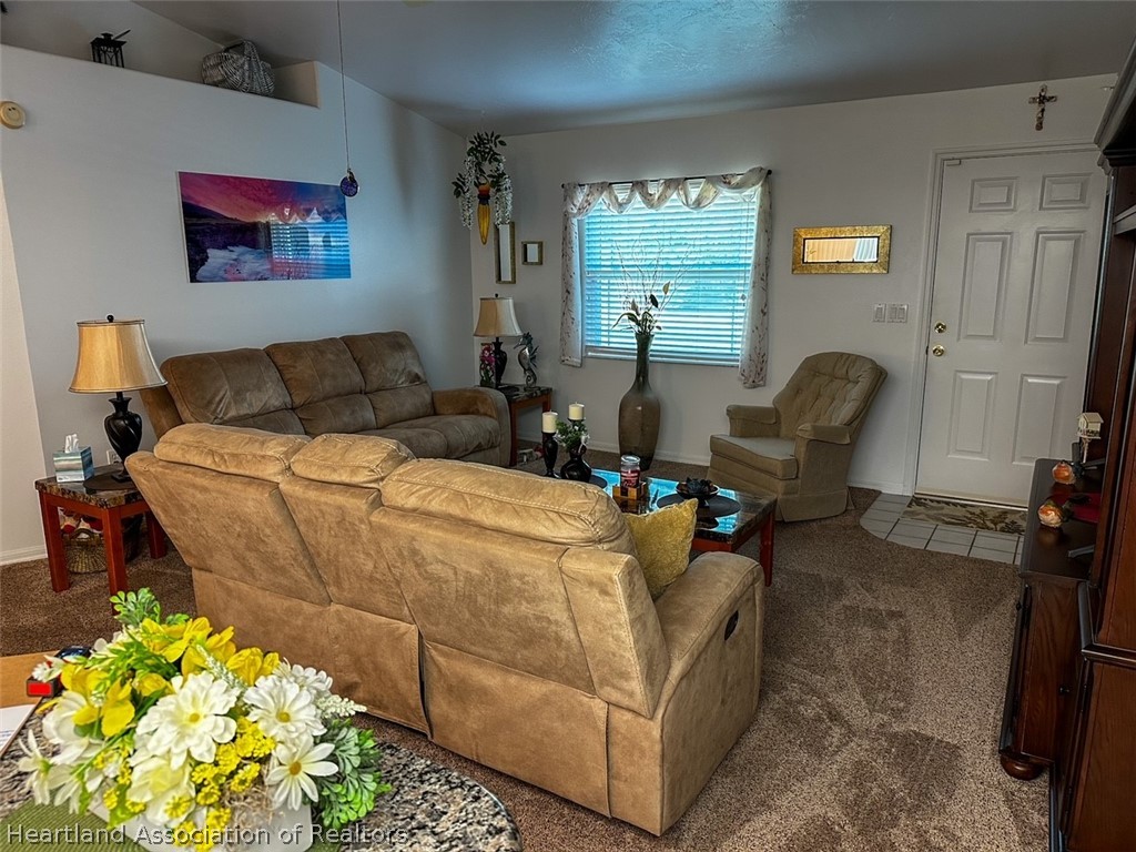 4428 Loquat Road Sebring, FL 33875 - Photo 11 of 29 a living room with furniture and a potted plant