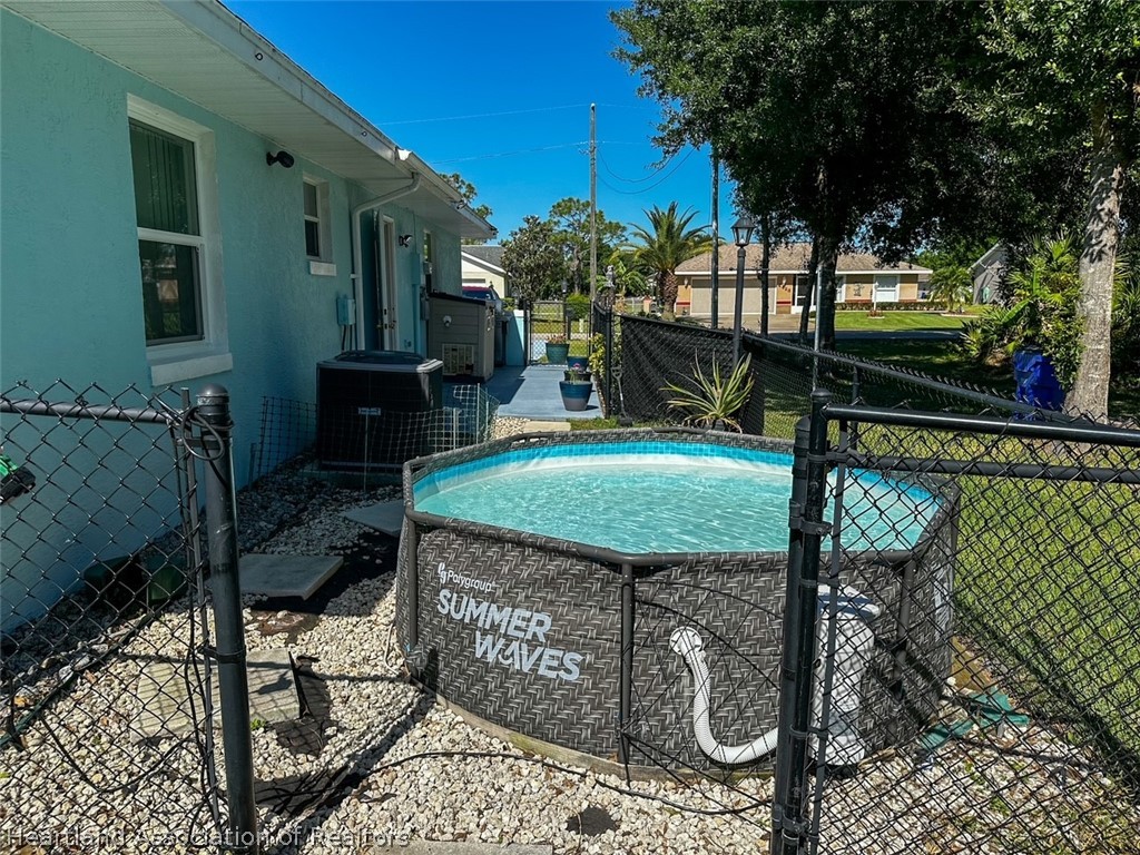 4428 Loquat Road Sebring, FL 33875 - Photo 6 of 29 a view of a chairs and table in the patio