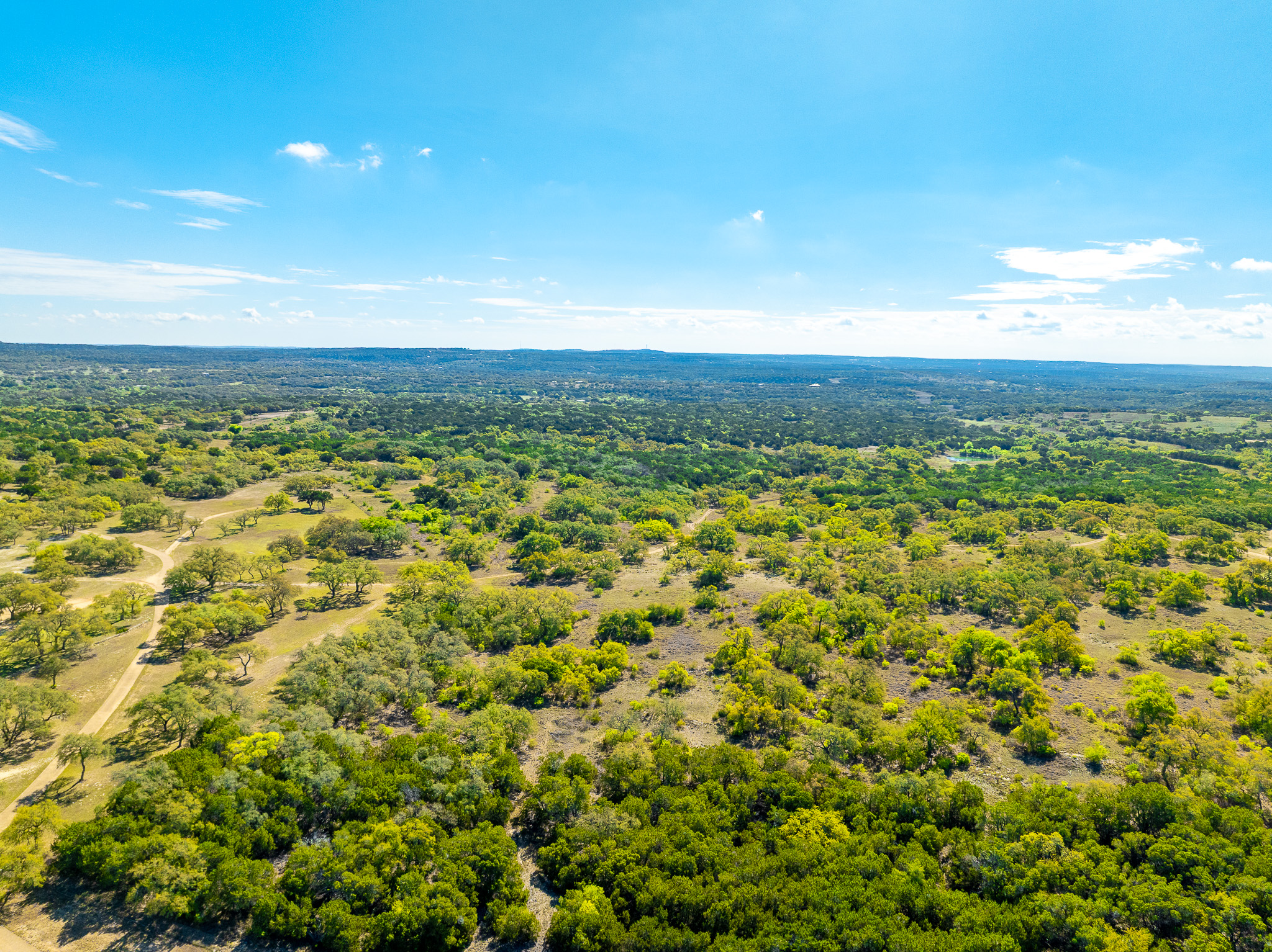 1100 Pump Station Road Wimberley, TX 78676 - Photo 20 of 40 a view of a large yard with an outdoor space