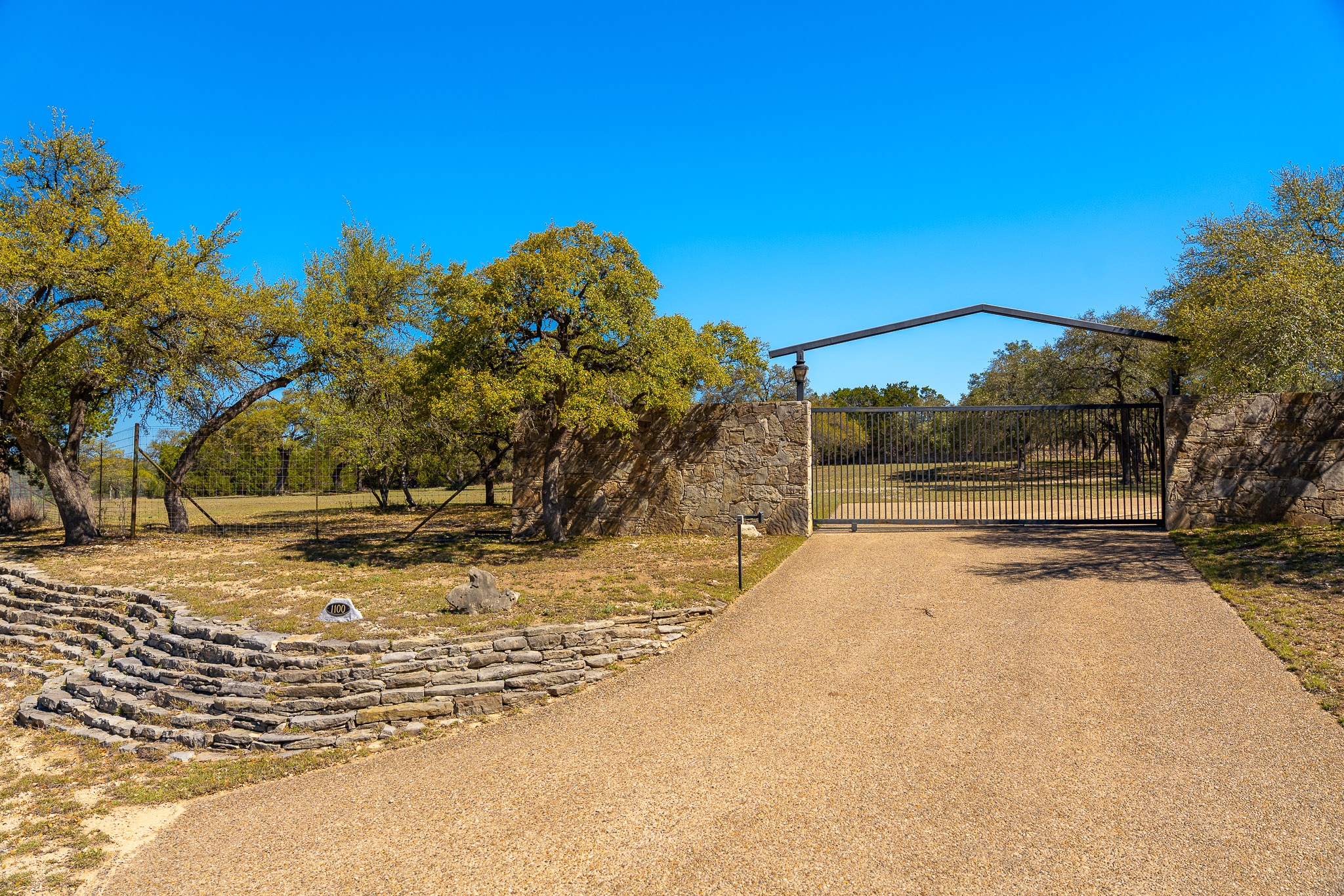 1100 Pump Station Road Wimberley, TX 78676 - Photo 38 of 40 a view of a yard with wooden fence