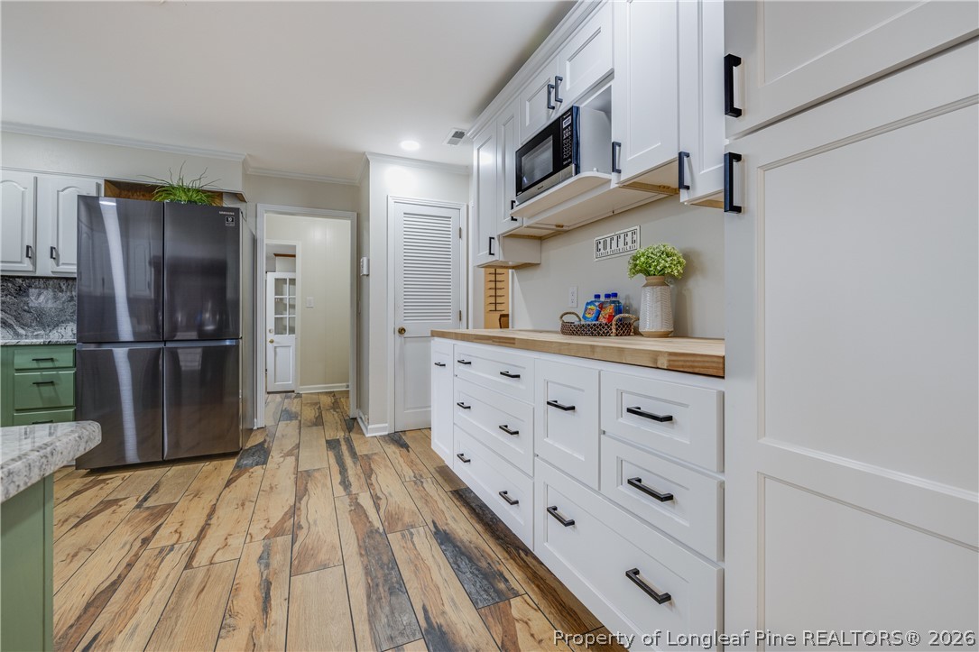 1250 Overhills Road Linden, NC 28356 - Photo 13 of 34 a kitchen with stainless steel appliances a refrigerator and microwave