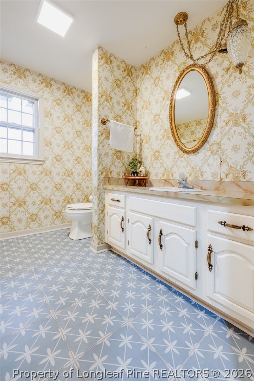 1250 Overhills Road Linden, NC 28356 - Photo 16 of 34 a bathroom with a sink mirror vanity and toilet