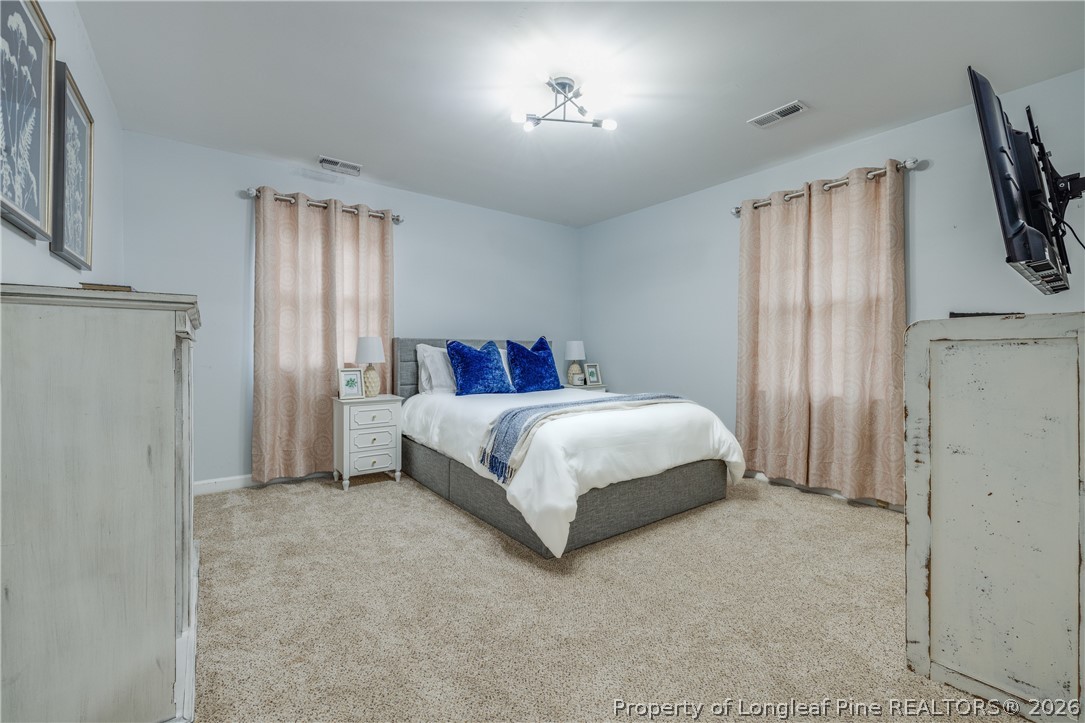 1250 Overhills Road Linden, NC 28356 - Photo 18 of 34 a bedroom with a bed dresser and a window
