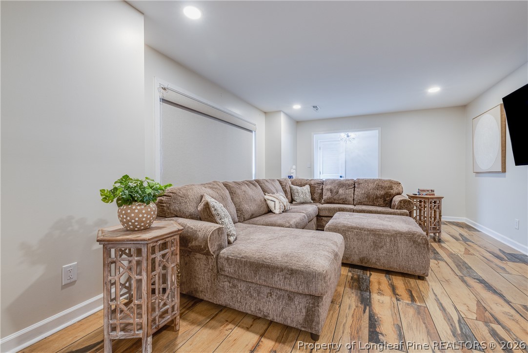 1250 Overhills Road Linden, NC 28356 - Photo 6 of 34 a living room with furniture a potted plant and a table