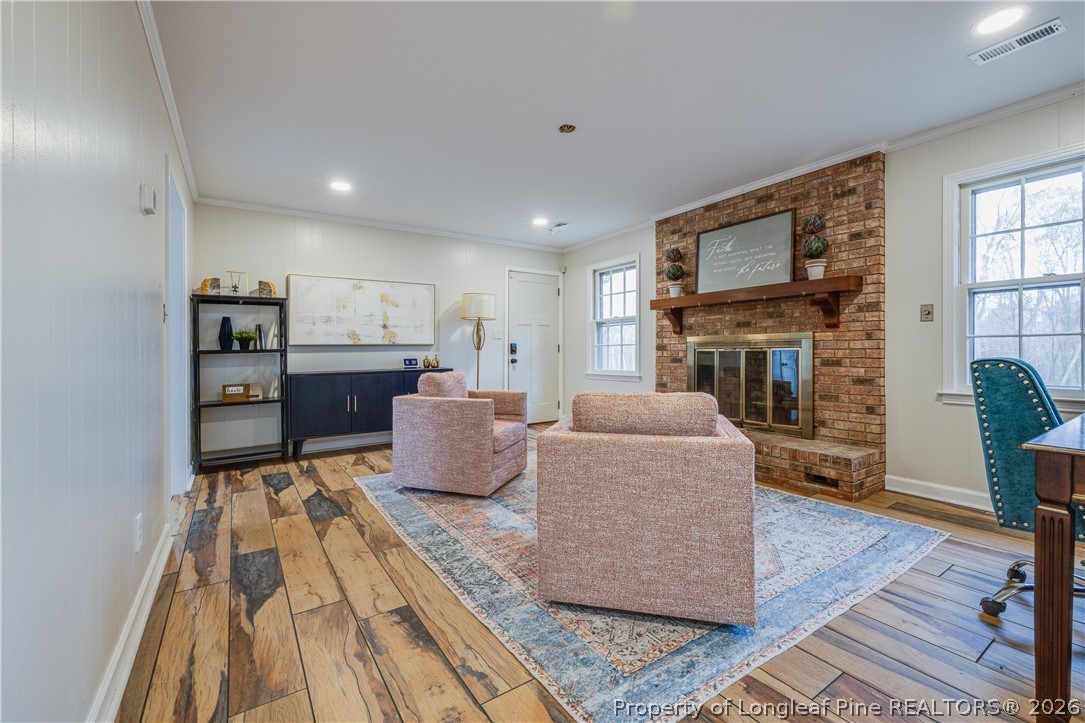 1250 Overhills Road Linden, NC 28356 - Photo 10 of 34 a living room with furniture and a fireplace