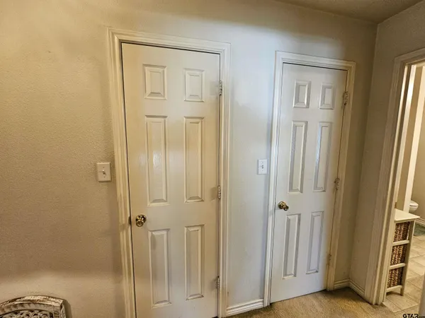 a view of a bathroom with wooden floor