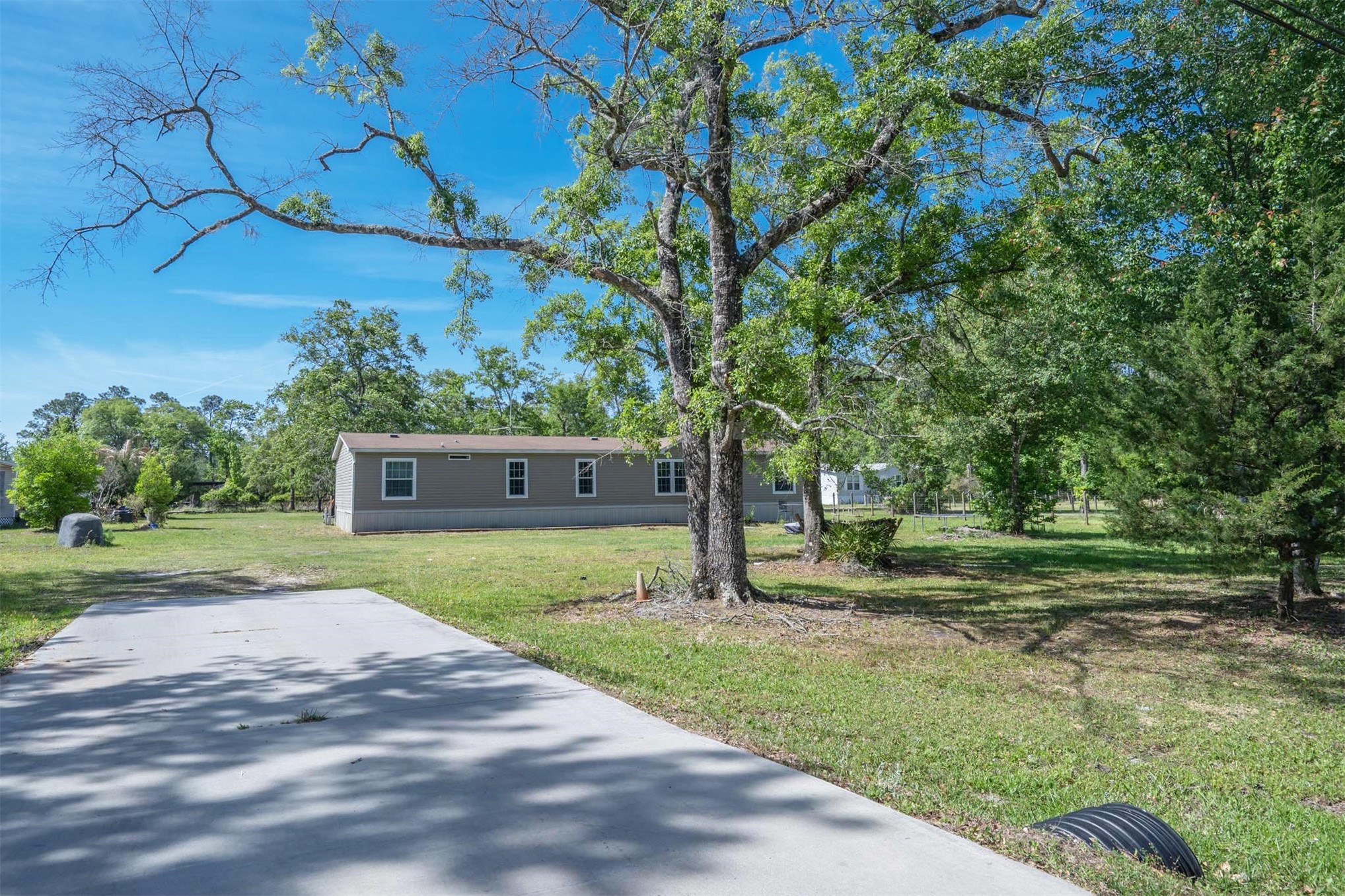 76220 Dove Road Yulee, FL 32097 - Photo 7 of 48 a view of a house with backyard and trees