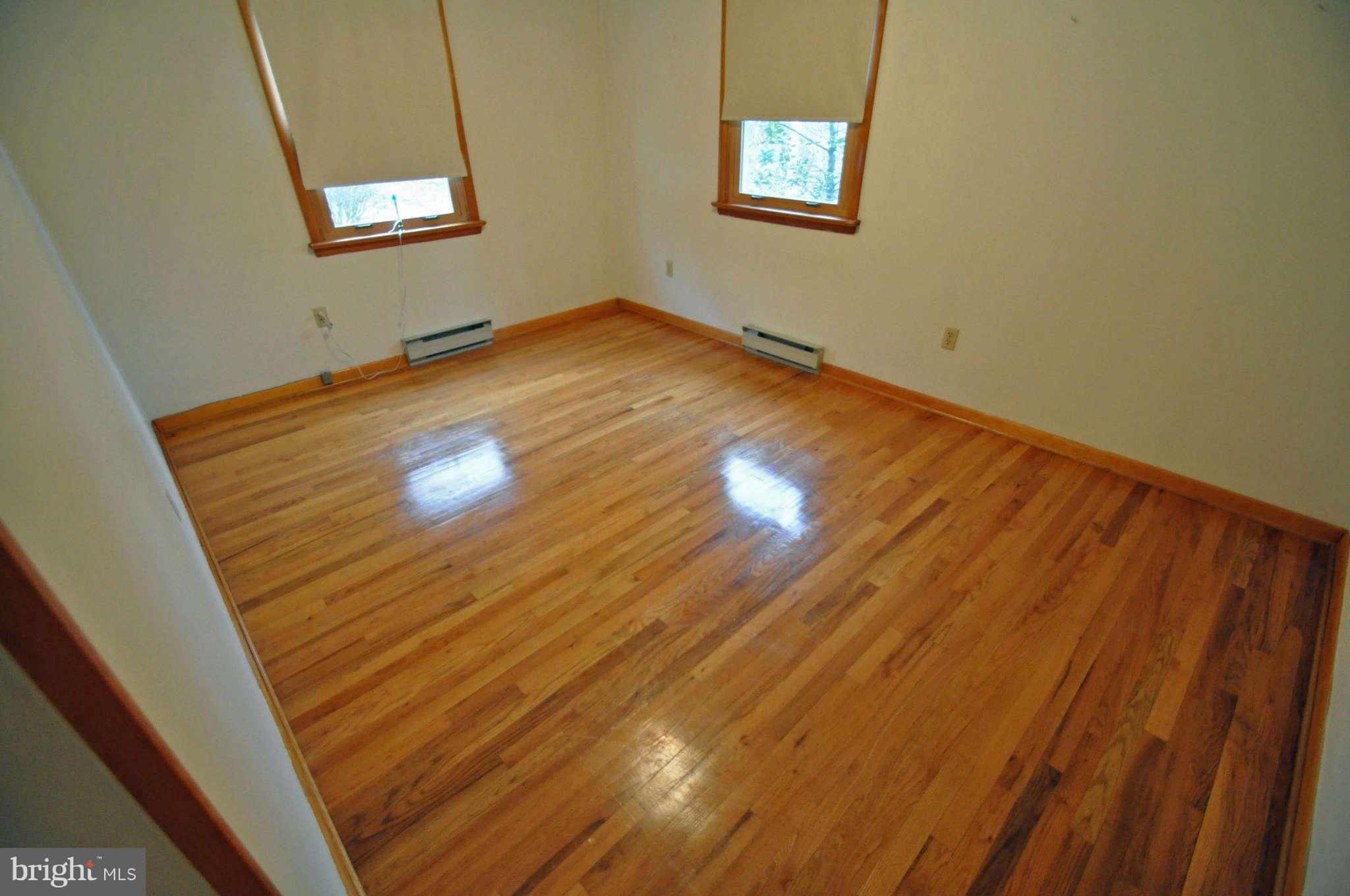 4915 Mt Zion Road Frederick, MD 21703 - Photo 20 of 30 a view of empty room with wooden floor and fan