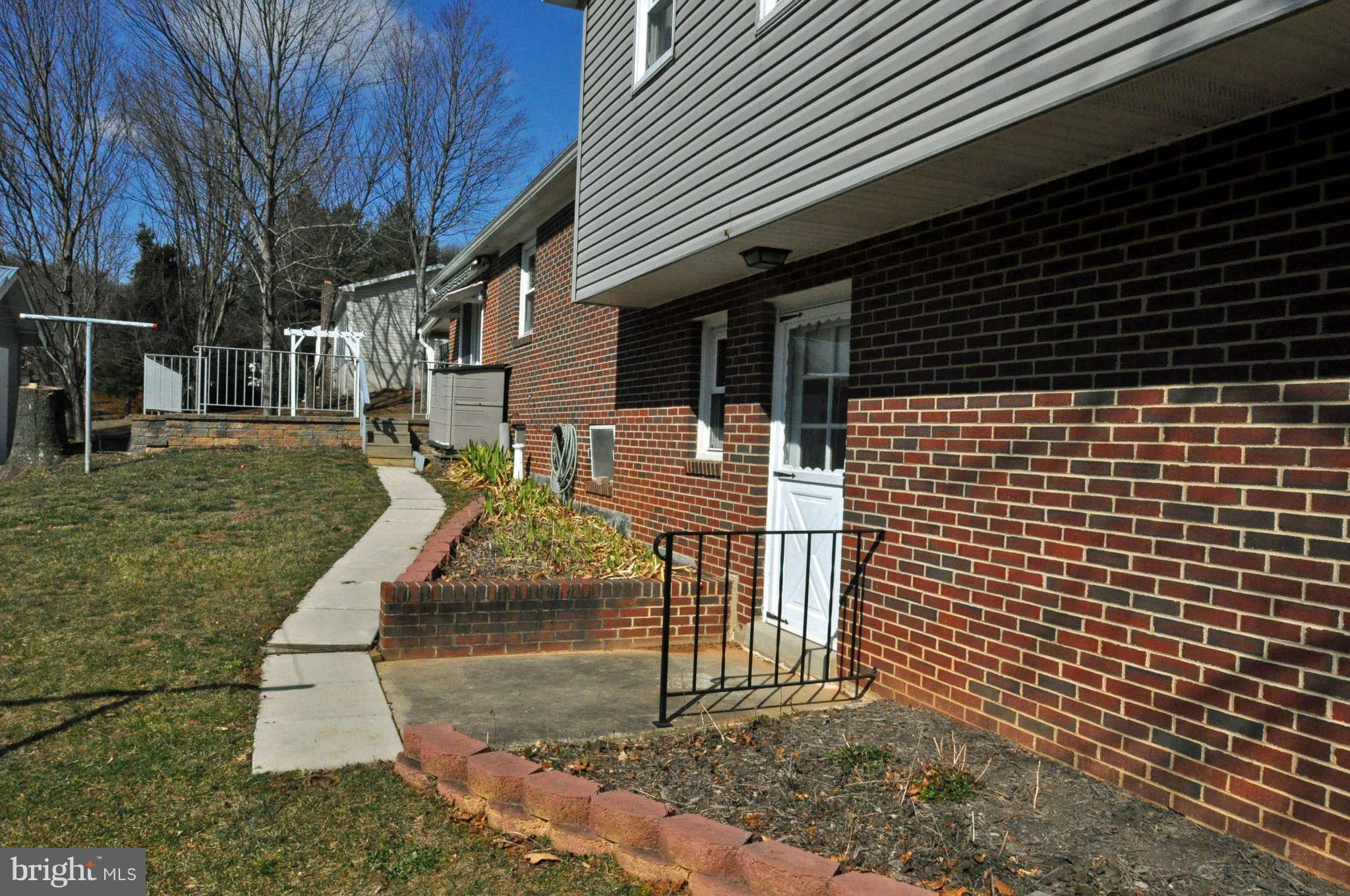 4915 Mt Zion Road Frederick, MD 21703 - Photo 6 of 30 a front view of a house with a yard