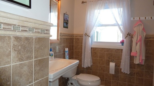 50 Casey Road Charlton, MA 01507 - Photo 24 of 30 a bathroom with a bathtub shower sink vanity and toilet