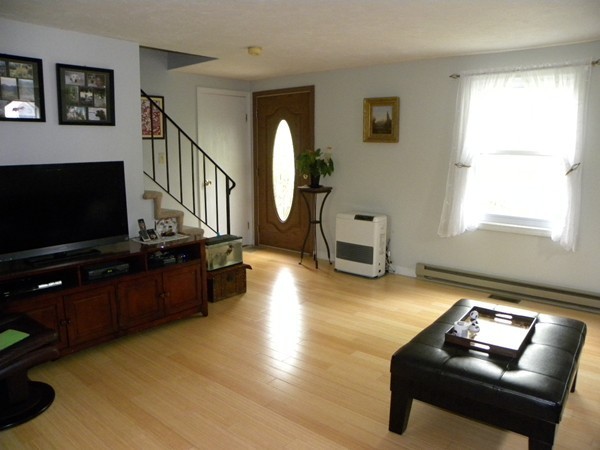50 Casey Road Charlton, MA 01507 - Photo 5 of 30 a living room with furniture and a flat screen tv