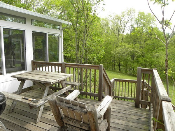 50 Casey Road Charlton, MA 01507 - Photo 8 of 30 a view of a chairs and table on the deck
