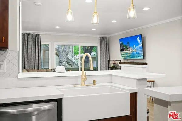 a bathroom with a sink and a large mirror