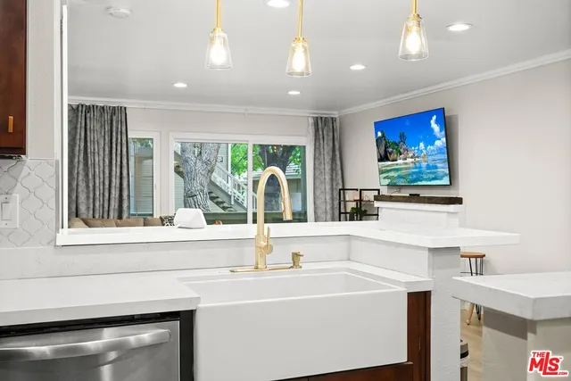 a bathroom with a sink and a large mirror