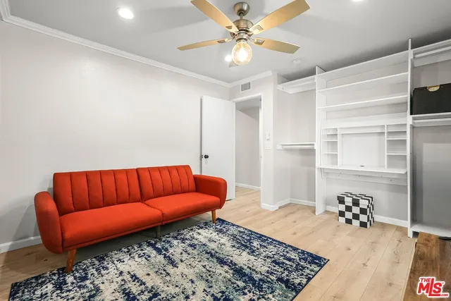 a blue room with a couch and a rug