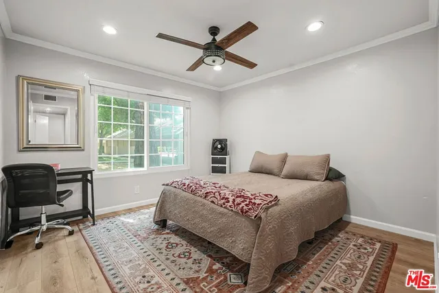 a bedroom with a bed and a chair