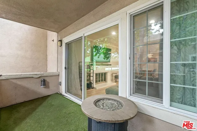 a view of a bathroom with a tub and door