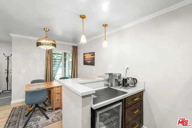 a view of a dining room with furniture and window
