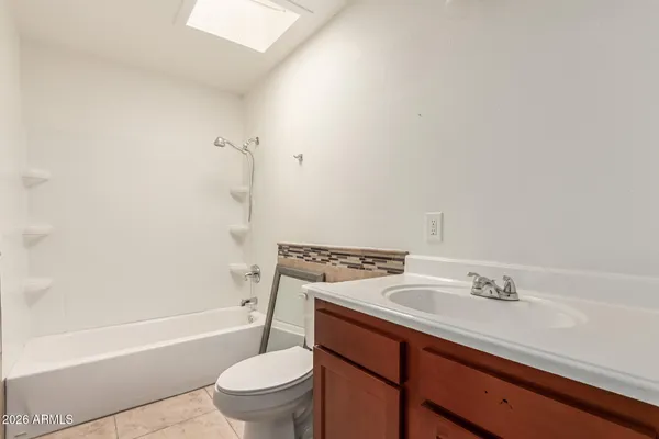 a bathroom with a sink a toilet and a bathtub