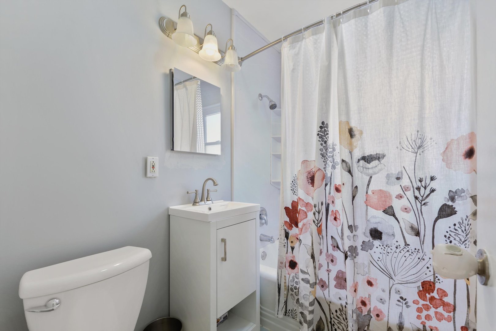 8151 Washington Street Niles, IL 60714 - Photo 11 of 18 a bathroom with a toilet sink and mirror
