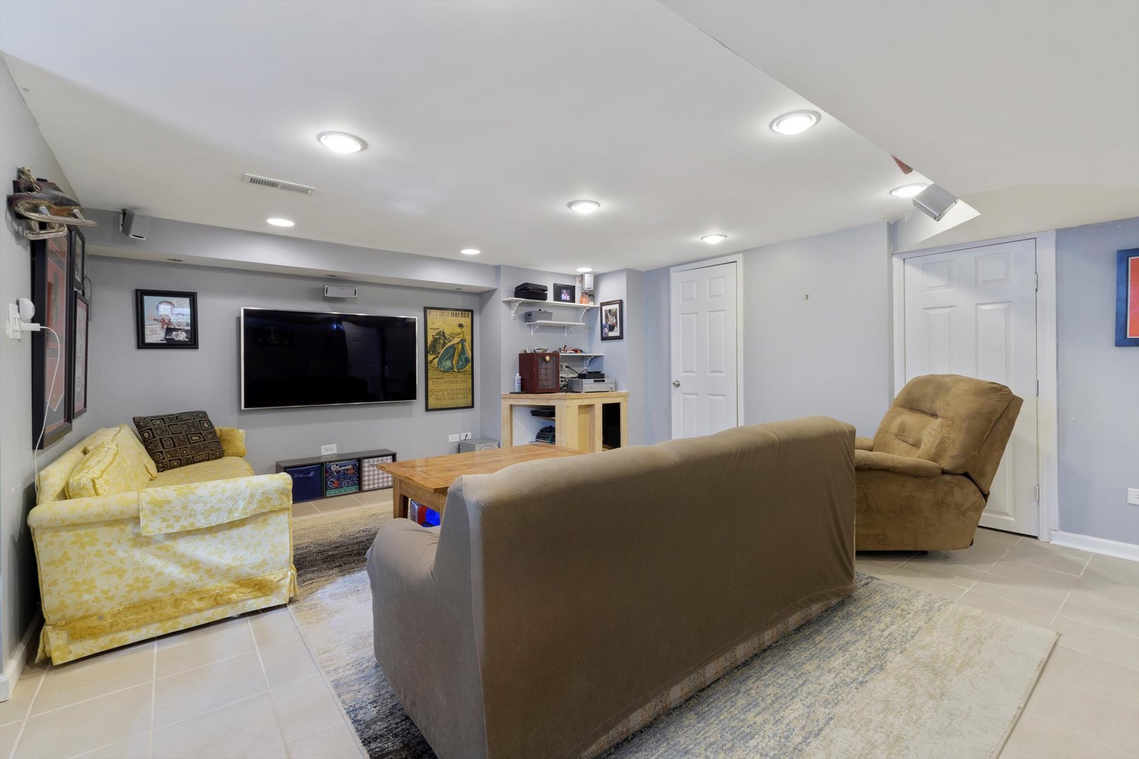 8151 Washington Street Niles, IL 60714 - Photo 15 of 18 a living room with furniture and a flat screen tv