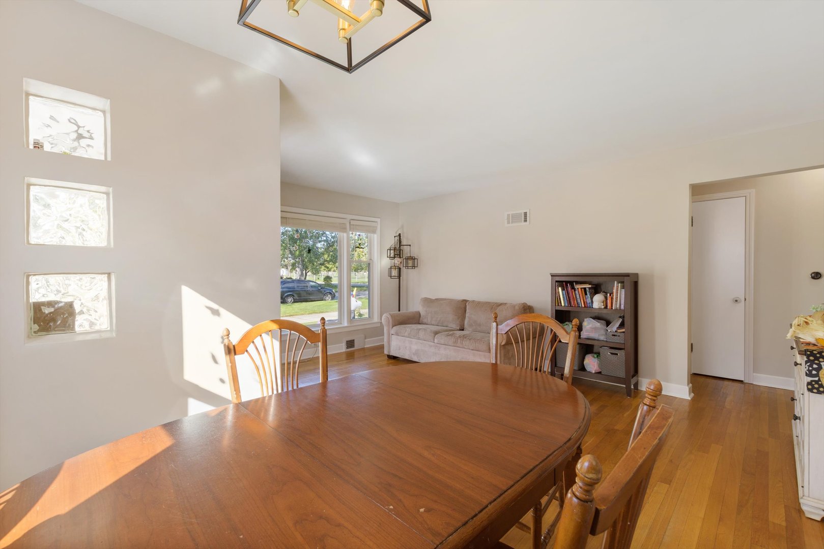 8151 Washington Street Niles, IL 60714 - Photo 5 of 18 a view of a dining room with furniture and wooden floor